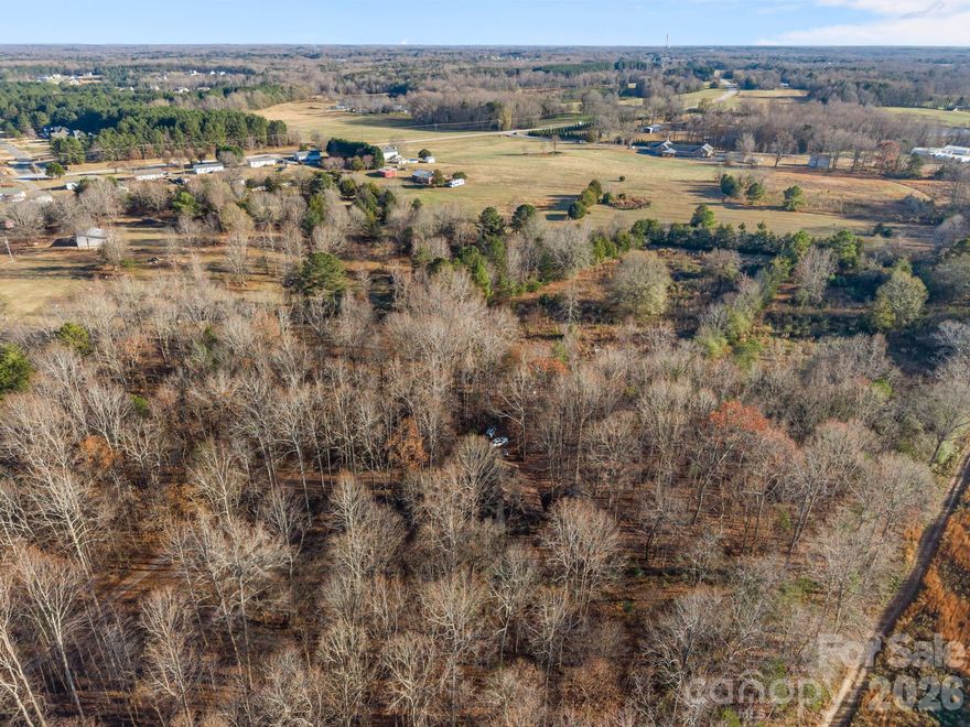 11.8 Private Acre Retreat in Clover!

The moment you turn onto the long, winding driveway surrounded by trees, you’ll feel like you’ve escaped to the mountains. Tucked away is a log house with a rocking chair front porch and a screened-in porch in the back that runs the length of the house. Perfect for morning coffee & watching wildlife. 

Step inside to experience the feel of a mountain cabin without the snow and long drive.  

The land offers wooded privacy along with usable space and includes an old barn previously used for horses—ideal for a mini-farm, horses, or simply enjoying the freedom of country living.

Peaceful and private, yet conveniently located near Lake Wylie shopping and dining, with an easy drive to Charlotte.

Now offered at $549,000—an opportunity to own nearly 12 acres in the Clover area, where space and privacy are becoming harder to find.