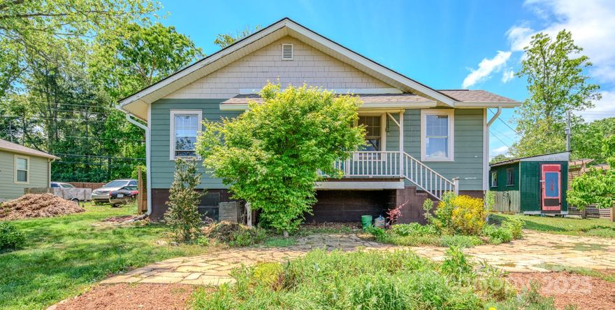 Welcome to this charming Asheville home that was built in 1919 and lovingly maintained with thoughtful updates throughout. Set against a backdrop of mountain views from both the front, back, and wrap-around porches, this home invites you to relax and take in the beauty of every season. Inside, the original heart of pine wood floors are in great condition and lend timeless character and warmth. The intentional landscaping is a true highlight, featuring big seasonal blooms, native species, medicinal herbs, and pollinator-friendly plants. This home's yard is an oasis with a flagstone patio and walkway that guide you through the lush garden to a picturesque gazebo and fire pit—perfect for gathering or quiet evenings under the stars. Full basement space provides plenty of storage. This is more than just a home—it’s a lifestyle.*