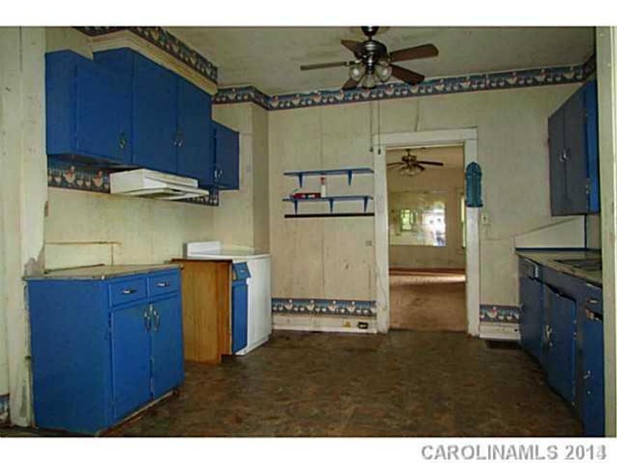 Great Investment property, double corner lot, fenced yard.  TLC needed, however very charming with good structure.  Established friendly Neighbors, Priced Below Tax VAlue and priced below recent Appraisal value.  Has lots to offer.  Must See.  Seller entertaining all offers.  Aggressive Seller!  Where Is, As Is