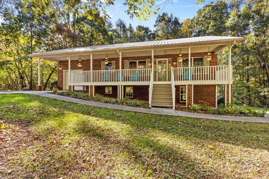 Nestled on 4.74 acres in the desirable China Grove area, this beautifully remodeled home offers the perfect blend of charm, convenience, and space. Just minutes from downtown and I-85, this property is ideal for a variety of lifestyles. With 2,058 heated sq. ft. and 349 unheated sq. ft., the main level features two spacious bedrooms and a stylishly updated bath, while the lower level boasts two versatile flex rooms (unheated), an additional bath, living space and a full kitchen—great for guests or extended family.  Unwind on the 300 sq. ft. covered front porch, an inviting space to relax after a long day. Inside, the open-concept layout seamlessly connects the living, dining, and kitchen areas, making it perfect for entertaining. The fully finished basement adds even more flexibility with its kitchen, living area, and office space.  With plenty of space and modern updates, this home is ready for you to move in! Schedule your showing today!