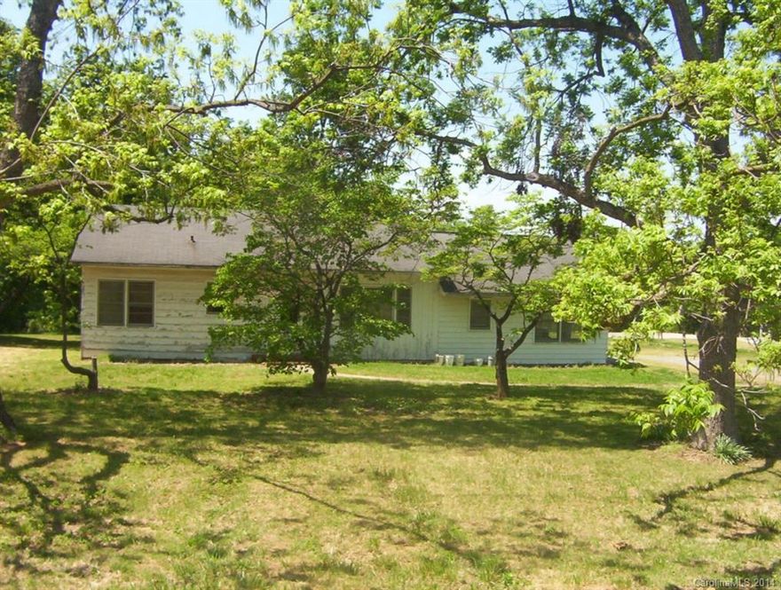 Nice friendly neighborhood, 2 bed, 1 bath on large lot, country setting yet very close to town. County taxes only. House needs some TLC but priced accordingly. Plenty of room to expand or have a large garden in back yard. Great for owner occupant or Investors to rent or flip.