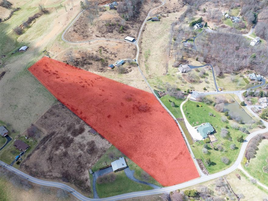 Spectacular 8 1/2+ acres of rolling pasture with 360 degree long range mountain views. Perfect for a private estate, hobby farm, or development in the highly desirable Jones Cove Road community. City water available through Junaluska Sanitary District.