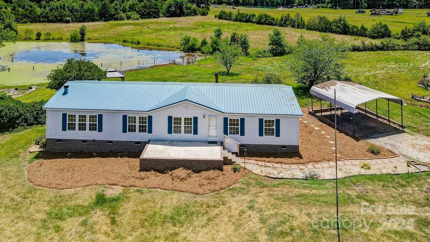 Looking for room to spread out...here is your opportunity in BUFORD school district. A total of 12.43 acres (4.87 acres combined with 7.56 additional acres). Home has been updated and includes new cabinetry, granite countertops, appliances and vanities. New deck on the rear of the home. Fresh paint and new waterproof vinyl plank flooring complete the makeover. House has a newer metal roof and HVAC. Property includes a masonry block, 8-stall horse barn (40x60) with ample pastureland and a private pond with a gazebo overlooking it. Property is fenced and gated. Listing also includes another 15x15 utility building with entry ramp. Bring your horses or other livestock - this property is ready to move in. Seller to pay $5000 in closing costs w/acceptable offer.