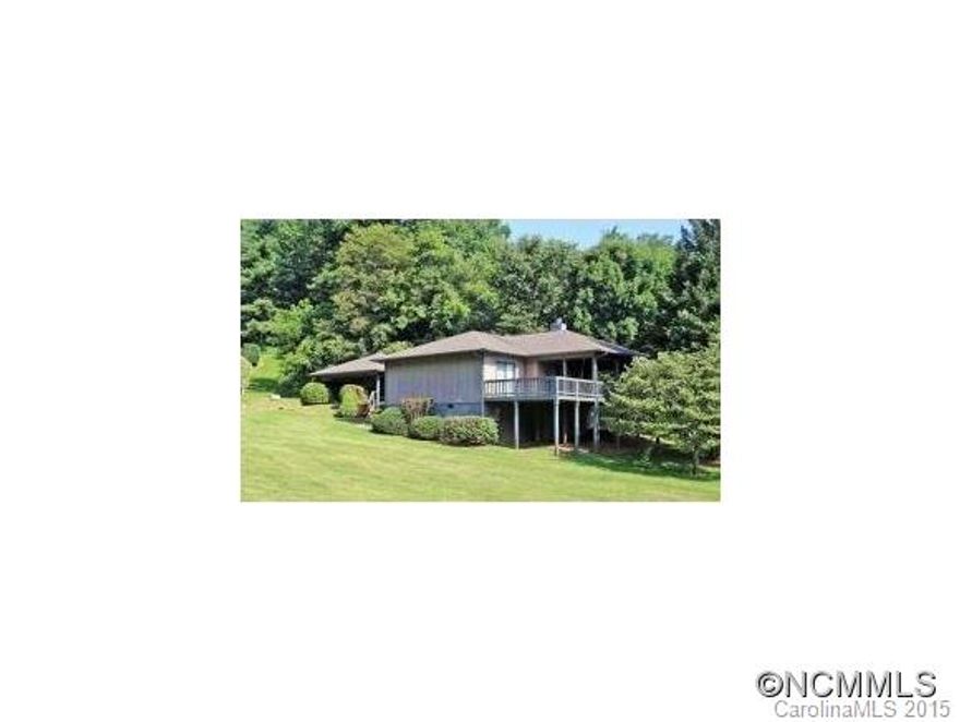 Enjoy single-level living at its best with this 3-bedroom 2-bath home. Easy access and located within 5 minutes from Downtown Waynesville, while being surrounded in a terrific neighborhood. This open floor plan offers a fireplace, split bedroom plan, breakfast bar, large covered front deck and a double carport. This home is being sold as mostly furnished. EM to buyers attorney.