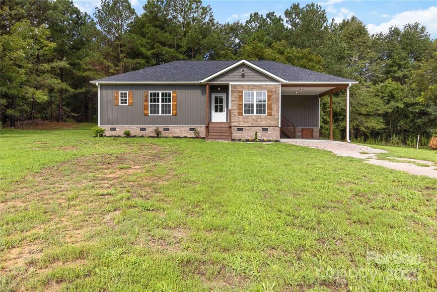 Experience the perfect combination of modern living and rustic elegance in this beautiful new-construction home on 2.69 acres. Featuring 3 bedrooms, 2 baths, and a detached carport, this 1,498 sq. ft. residence welcomes you with charming board-and-batten siding that sets the tone for its warm, inviting style. Step inside to an open, light-filled floor plan designed for easy living and entertaining. The kitchen boasts a center island, granite countertops, and stainless steel appliances, and flows seamlessly into the spacious great room with a cozy fireplace. The primary suite offers a dual vanity and generous storage, while all bedrooms provide ample space and comfort.
Relax on the covered back deck, taking in peaceful wooded views and the tranquility of your private acreage. This home delivers both style and serenity-perfect for those seeking a blend of comfort, charm, and space to breathe.
Back on the market at NO FAULT of the seller.