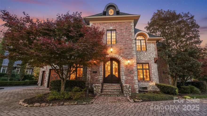 Enjoy luxurious gated living in this European inspired enclave with paver streets, gas lanterns and lush landscaping. 2310 La Maison Drive is stunning outside, with a mix of brick, stone and wood, and more high-end craftsmanship inside. Enter the foyer to the floating curved staircase, with formal living on one side, and dining on the other. There's a den with doors to the back terrace, overlooking the community's private pond with fountain. The updated kitchen has a SubZero refrigerator, paneled drawer dishwashers, two ovens and Wolf gas cooktop. A bay window breakfast area, also overlooks the water, as does the primary suite with luxurious bath with jetted tub and steam shower. An elevator takes you from the garage level (3 car garage w/power for car lift), all the way to the top floor. Floor 2 has a library/flex area, another family room and four bedrooms, all with ensuite baths, and a balcony overlooking the lake. Floor 3 has the perfect bonus space, and another bedroom & bathroom (this could be a private suite, as there is plumbing for a bar/kitchenette). Notable touches throughout with marble, exquisite millwork, heated floors, two laundries and more. Convenient location just off of Sharon View Road at Carmel, with easy access to SouthPark. Available for private showings and SO MUCH HOUSE FOR THE MONEY! Welcome home.