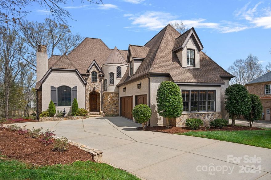 Play where you live in this gorgeous waterfront custom home w/pool. Nestled on one the largest picturesque lots in the sought-out gated community of Victoria Lake. Features stone alcove entry, custom wood front door, hardwoods throughout, high ceilings, heaving moldings, light filled rooms, neutral paint, & renovations throughout in 2020.  Kitchen is updated w/chef’s needs in mind to include large island, high end cabinetry, Wolf range, walk in ptry & more. Primary suite located on main w/vaulted beam ceilings & spa like bath w/freestanding tub, dual sinks/counters, walk in shower, & his/her closets. Also includes office, large lndry w/sink, office, workstation, living room, wine cellar w/iron doors. Upstairs includes  3 more bedrooms, loft, 3 full bathrooms, & bonus/5th bedrm.  Enjoy the 3 season sunroom w/outdoor fireplace or open the windows & listen to the sounds of nature or the fountains coming from the lake. Gorgeous pool & decking. Convenient to restaurants, shopping & I485.