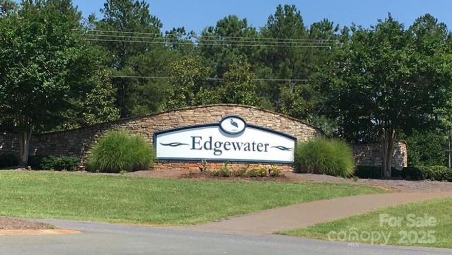 Edgewater has it all! Enjoy amenities such as an 18-hole golf course, marina with rentable boat slips and a kayak launch site on Fishing Creek Lake, miles of walking and biking trails, a clubhouse and swimming pool. The Village Center is under construction and will include a restaurant/bar and pickleball courts. Lot 245 is a basement lot. It is steep in front and levels out at the top, backing up to a green area.  Capital contribution is $500. 2025 HOA Master fee is $528; 2nd HOA fee $275, for a total of $803/year. This is an interior lot with a minimum home square footage of 1600. The lot has been cleared and is ready for your dream home! Don't miss a chance to be a part of this award-winning 2024 Community of the Year!
