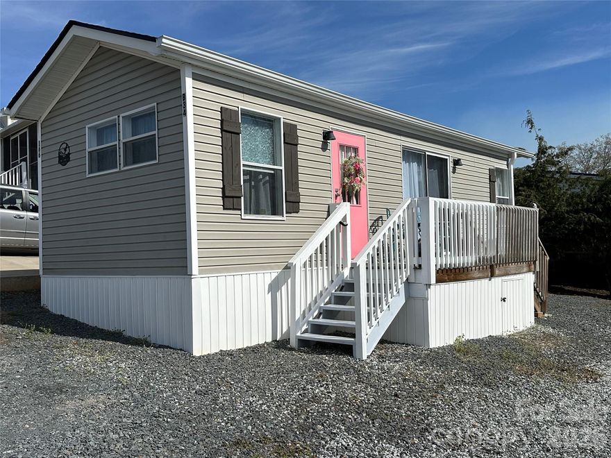 Move-in ready one-bedroom park model home in Badin Shores Resort! Recent 2024 updates include a new roof, new gutters, vinyl skirting, and fresh interior paint. Skylights fill the home with natural light, highlighting the high ceilings and creating a bright, airy feel throughout. The open-concept kitchen, living, and dining area provides an ideal space for entertaining or hosting dinner guests. Whether you're looking for a full-time residence or the perfect vacation getaway, this property offers both comfort and convenience. Enjoy the resort lifestyle with amenities that include a swimming pool, putt-putt, basketball and pickleball courts, fishing pier, sandy beach, playgrounds, and an active events committee that hosts numerous community activities throughout the year.