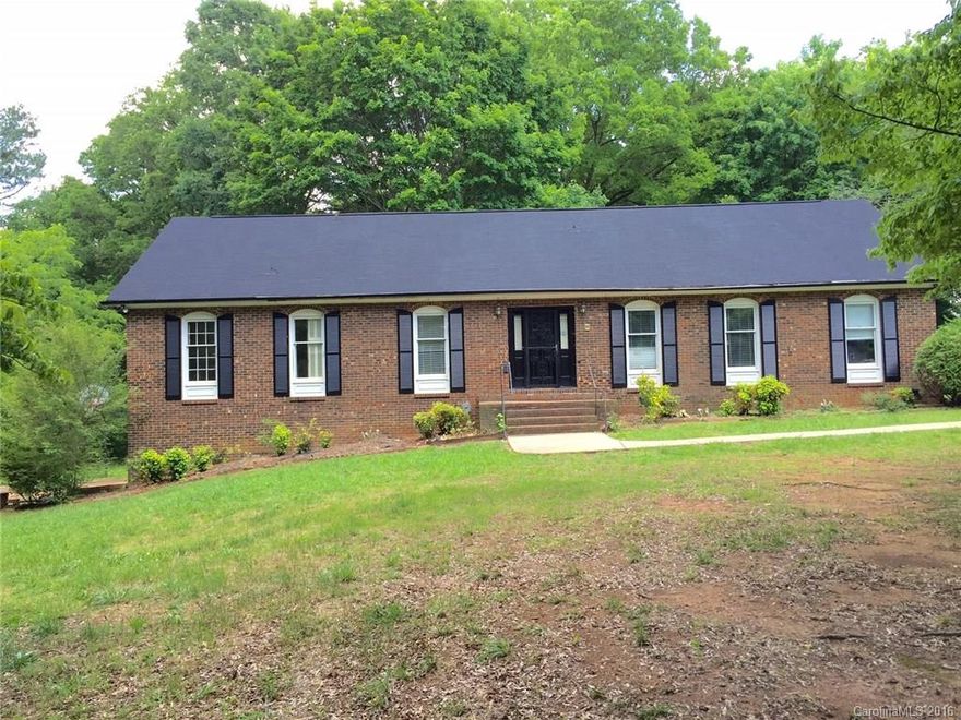 REDUCED!    7.5 approx acres total! PRICED BELOW TAX VALUE! House has lots of potential and is on 3.85 acres! Sold As-Is. adjoining parcels 099-311-06 and 099-311-07 approximately 3.55 acres. (see aerial photo) are included in the price.   Location is close to shopping and dining and just a short drive from Uptown Charlotte entertainment district. Ready for your personal touch and TLC!