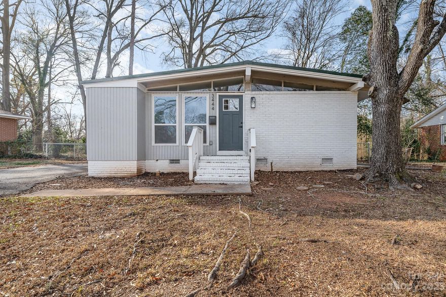 Experience modern luxury in this completely renovated 3 bedroom 2 bathroom home.  This gorgeous modern ranch home is move in ready with an abundance of natural light streaming through its large windows. Enjoy comfort and efficiency with the newly installed HVAC system from 2022 and roof replacement in 2022. The open-concept living, dining, and kitchen boasts gorgeous refinished hardwood floors and are perfect for entertaining. The sleek kitchen is equipped with quartz countertops, stainless steel appliances, an inviting eat-in island, and custom cabinetry for ample storage. The primary bedroom is a retreat with its private bathroom featuring a combination tub and shower, dual vanity sinks and an elegant glamour mirror. This location can't be beat, it is conveniently situated near parks, shopping, dining, airport, and downtown Charlotte.