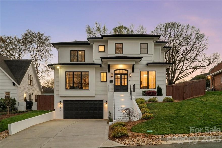 Welcome to Magnolia House! A rare gem nestled in the heart of Dilworth. Every detail of this home was meticulously designed to create a modern and open layout without losing warmth and charm. You will be wowed the moment you step in the door. White oak hardwoods span throughout the home, but your eyes will be drawn to the true showpiece of this home: a floor-to-ceiling glass, temperature-controlled wine vault housing over 500 bottles. An upstairs primary suite that is truly jaw-dropping with a sleek, 60-inch fireplace, but the true jaw-dropper is watching your 75-inch television drop down from the ceiling. Your lavish primary bath is sure to give you a spa-like experience. A floor-to-ceiling tile shower featuring 6 shower heads, 4 of which are rain head style that function fully automated by UbyMoen. The bottom level of this home houses what can function as a guest suite, in-home chef suite, or in-home nanny suite.  Furniture Negotiable.