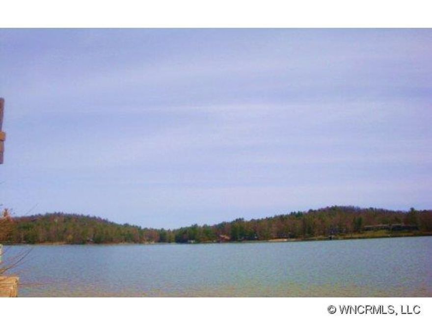 Magnificent lake lot situated on the southwestern shores of Lake Toxaway This.49 lot looks out over the southern end of Lake Toxaway with an open and extensive ï¿½big waterï¿½ view. Located on the quiet and prestigious street of East Shore Drive within Lake Toxaway Estates, this lot is gently sloping with a stone seawall, ready to build with a three bedroom septic permit in place.