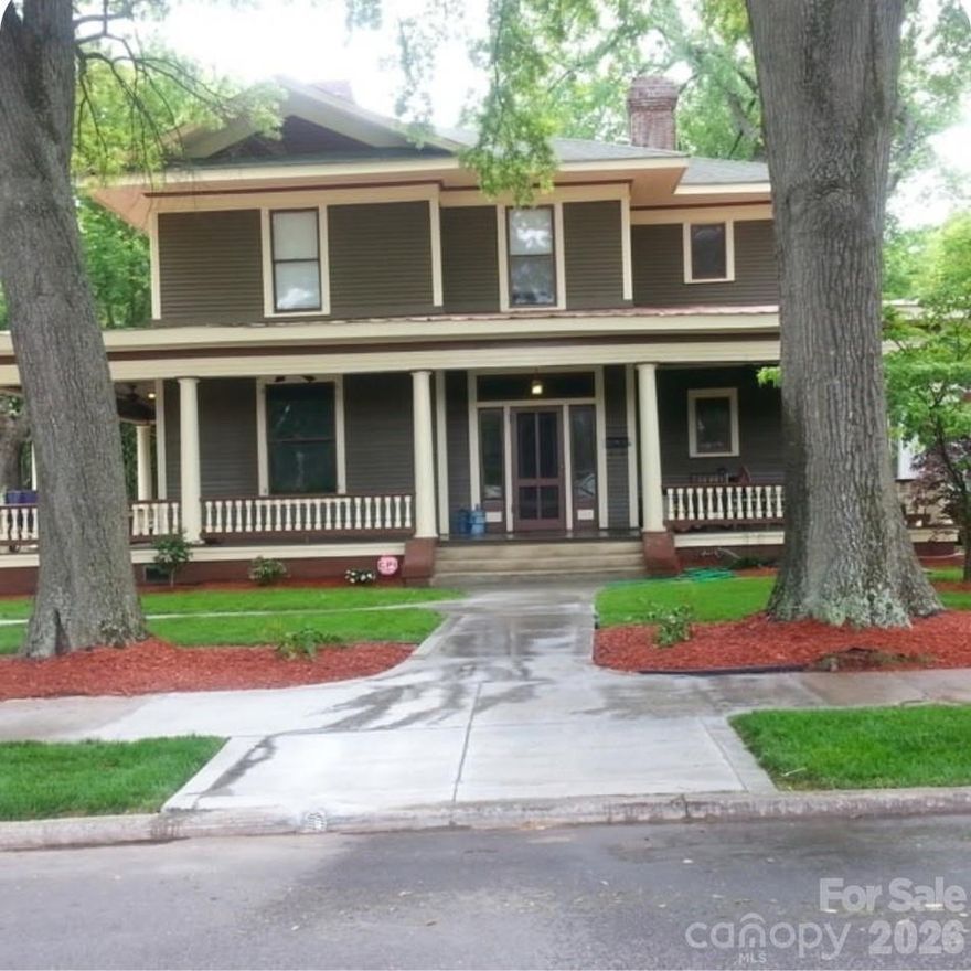 This beautifully maintained 4 bedroom, 2.5 bath home is located in the historical district of Rock Hill SC. It has been designated as a historical home and is subject to CCR's. It has a wrap around porch, hard wood floors throughout and 6 fireplaces . The enhancements include Oak upgraded trim work, upgraded stairway, carpentry, kitchen and baths. The roof was replaced in 2024. The master bath was remodeled 2 years ago. It includes a walk-in shower with glass doors and a soaker tub.