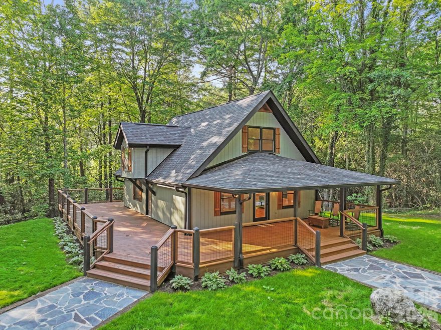 If you're seeking a tranquil mountain retreat, look no further. Nestled along the boundary of Gorges State Park, this property offers exceptional privacy, breathtaking seasonal views into South Carolina, and minimal neighboring homes.

Originally built in 1987, the home has been completely renovated from top to bottom in 2024, with final touches completed this year. Updates include a new roof, HVAC system, plumbing, flooring, doors, and much more—making this home truly turnkey. Inside, you'll find wood floors throughout and a bright, open-concept layout that seamlessly connects the kitchen, living, and dining areas.

The beautifully updated kitchen features new appliances, granite countertops, a subway tile backsplash, and a stylish beverage bar complete with a wine cooler. The lower-level bedroom includes a sliding glass door that opens directly onto the deck, creating an effortless indoor-outdoor living experience. Each bathroom has been thoughtfully designed with marble tile and custom glass enclosures, while the upstairs offers two additional bedrooms and a full bath with a freestanding soaking tub.

Step outside to enjoy a spacious deck, partially covered and equipped with recessed lighting and ceiling fans—perfect for relaxing or entertaining year-round. An additional outdoor building provides flexible space ideal for a guest suite, home office, or creative studio.

Whether you're looking for a full-time residence or a vacation rental opportunity, this home offers the perfect blend of comfort, style, and mountain serenity.