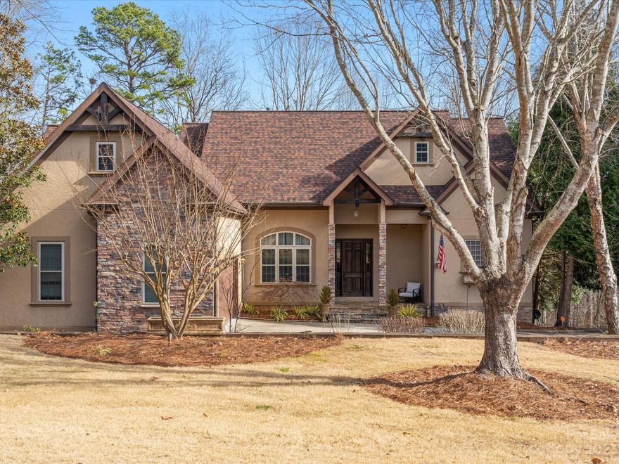 Here is the chance to get into the exclusive Beckenham community. With just over an acre of land, this home offers privacy, luxury, and a quiet retreat. Located in Fort Mill and their top ranked schools, this residence radiates classic traditional beauty. As you walk through the front door, you are greeted with cathedral ceilings and a vast open floor plan. The kitchen is lined with Viking appliances and granite countertops. Hardwood floors sprawl out the entire main floor which includes the primary bedroom with recently updated (2020) primary bathroom! Upstairs has two bedrooms and two full bathrooms. The fully finished basement has an additional two bedrooms and two full bathrooms (one of them a steam shower) and a partial kitchen/bar area. Lastly, there's an extra office or bonus room situated above the garage. The backyard has a wooded view with maple and fig trees in a serene environment and an attached work space on the back of the house! Come make this 5 bed/5.5 bath home yours!