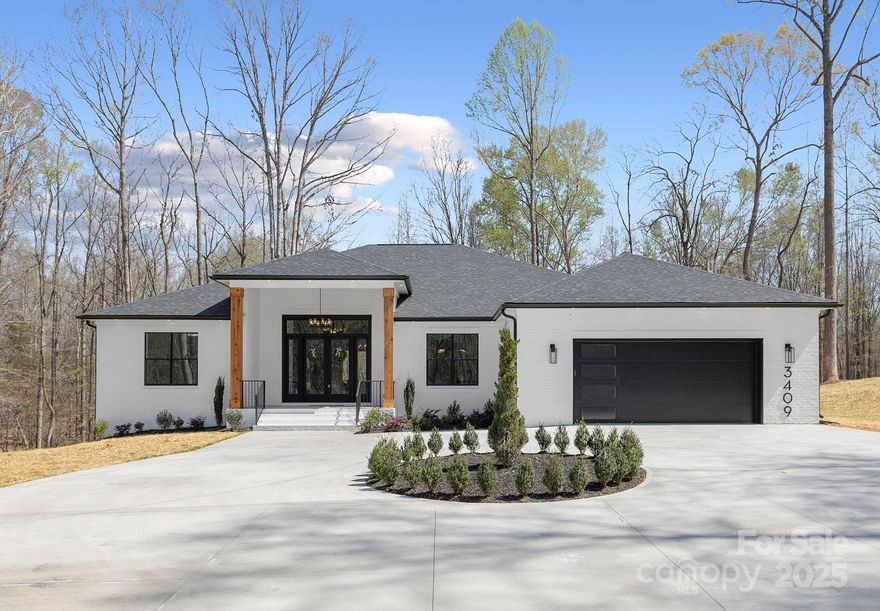 Welcome to this beautifully designed 3 bedroom 3 bathroom plus office ranch house! Featuring an open floor plan that blends style and functionality! A spacious living area with abundant natural light flows seamlessly into the kitchen and dining space, creating the perfect setting for entertaining! Gourmet kitchen with oak and white cabinets, custom hood, sleek backsplash, a sprawling quartz island and a farm sink! A large butlers pantry that connects to the garage door for easy access! Large living area boast a cozy fireplace. Primary bedroom with an en-suite bathroom features a free standing soaking tub, a glass enclosed rain shower, dual vanities, floor to ceiling tile and a large walk in closet! Primary bedroom also has a large sliding door accessing the back porch with the most serene forest views! Home is nestled in a fast growing location near downtown Waxhaw and is sitting on a two acre lot with no HOA, a rare find!