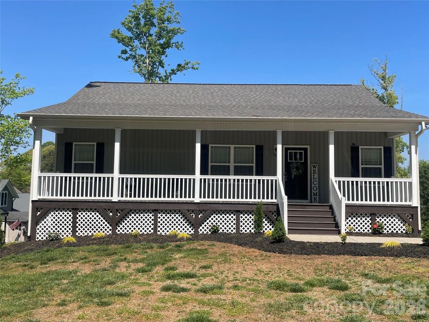 WOW—Lake Norman water views from this fabulous ranch home with a finished basement! Step into this well-maintained home featuring beautiful LVP flooring, neutral paint, and an open kitchen with 42" cabinets, granite countertops, and a large pantry—tastefully finished throughout. The main level offers a spacious primary bedroom with ensuite, including a large walk-in closet and dual vanity.  A second bedroom and full bath, laundry room, living room, breakfast area and oversized coat closet complete the main floor. The newly finished basement leaves nothing undone, featuring a mini -split system, and a bright, open layout with glass doors leading to the large backyard and lake views. Flexible basement space offers options for an additional living area, flex space, and a separate office or exercise room, plus a convenient half bath. Two separate storage areas provide ample space. Enjoy the opportunity to take in beautiful lake views and all this home has to offer. The neighborhood amenities include a boat ramp, firepit area, and picnic area less than 1/10 mile away—easily accessible by golf cart, walking, or biking. Refrigerator, washer, and dryer convey.