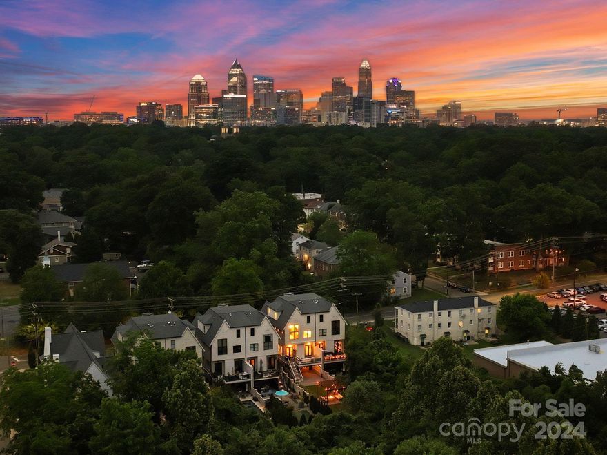 Welcome to luxury living at its finest in the heart of Dilworth! This stunning, updated townhome epitomizes elegance and sophistication, boasting a prime location walking distance to all the attractions of Southend. Recently updated with exquisite marble accents, luxurious new lighting fixtures, every corner exudes opulence. Beautiful white oak floors, custom cabinetry, Thermador appliance package, paneled refrigerator & dishwasher, and built-in microwave. Six sets of Sonos in-ceiling speakers located in the primary bedroom, bathroom, great room, dining room, covered patio, and rear deck. There are two interior gas vent-less fireplaces in the great room and dining room. The living room opens out to a private balcony. The upper-level primary features a vaulted ceiling with wood beams and tons of closet space. The backyard oasis is complete with a built-in gas fireplace & turf, offering the perfect retreat. Let's make this meticulously crafted townhome your own slice of paradise!