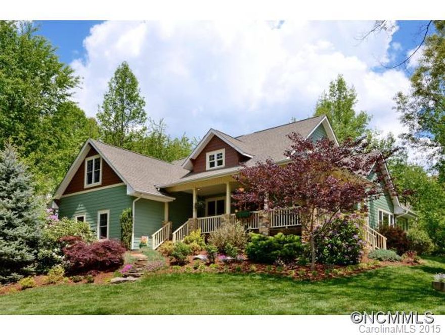 Quality Arts and Crafts style is yours in this custom home located in park-like setting & great community. Home offers 4BR/4.5BA gourmet kitchen, granite counter-tops,SS Appliances great room has cathedral ceiling & rock fireplace, sun room, master suite w/tray ceiling, luxury master bathroom, his/her walk-in closets, family theater room in lower level with wet bar, workshop & 2-car garage. Located conveniently between Waynesville and Asheville!