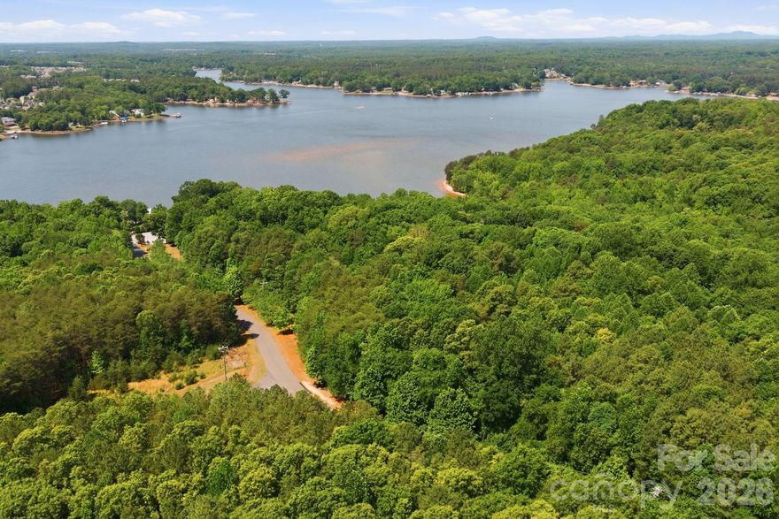 Rare, main channel, large tract opportunity with water frontage and access on Lake Wylie. Conditionally zoned through Mecklenburg County for 32 residential lots.  Subdivision plan submittal required for approval with City of Charlotte.  Can be combined with residential listing MLS#4382620 to achieve more than 900' of water frontage and redevelopment opportunity.