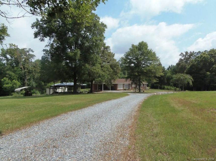 USDA eligible, 3 bedrooms, 2 full baths, hardwoods, large rooms, stream on back of property, 2 outbuildings, covered area for travel trailer or farm equipment, Koi pond. additional acreage available, please inquire. 10 mins from Rock Hill. County taxes, horses permitted