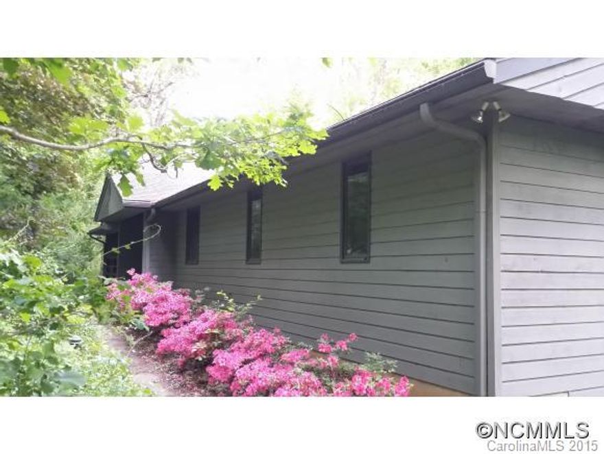 Huge end of the road property straddling Chunns Cove & Town Mountain with existing partially dismantled home ready for rehab. Home suffered water damage & is stripped down for remodel. Large great room with central fireplace and pine T&G vaulted ceiling. Large deck with covered section. Big family room in basement also with fireplace. Wooded land, but great view potential & sites for more homes. Septic unknown. Subject to court approval,cash only