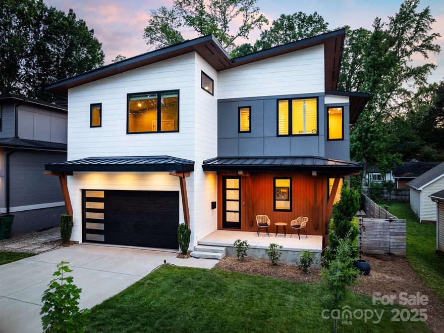 Modern luxury meets energy efficiency in this stunning 2021-built home! Enjoy a luxurious saltwater Pebble Tec pool & spa, plantation shutters, and a sleek see-through gas fireplace. Eco-friendly features include solar panels with 2 Powerwalls (installed 8/2024), on-demand gas water heater, whole-house air purifier (2025), sealed crawl space, and 2 EV charging stations. The layout boasts two spacious primary suites—one on the main level and one upstairs—perfect for flexible living. Custom closets, wet bar, Bosch refrigerator, stainless steel appliances, and under-stair storage add function and flair. Gorgeous bathrooms, large windows, and oversized bedrooms create a light-filled, welcoming atmosphere. A backyard storage shed adds convenience. Ideally located just 10 minutes from Uptown Charlotte, near The Health Club and The Common Market. This home blends modern luxury, smart upgrades, and ideal location into one incredible opportunity.