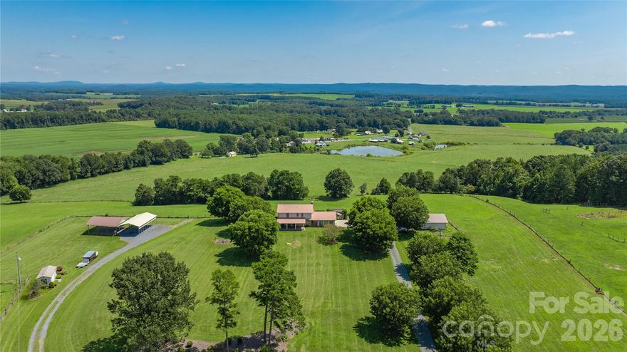Experience the ultimate blend of elegance and country living on 33+/- acres with panoramic views and unforgettable sunsets. This beautifully appointed 3-bedroom 3 bath home offers a bonus room & home office, perfect for work and relaxation. Heated & cooled basement. Entertain outdoors with Trex Decking expansive covered porches, a custom stone grilling station with hot/cold sink, & a cozy propane fire pit overlooking rolling landscapes. Exceptional amenities include a detached heated/cooled 2-car garage, 900 sq ft climate-controlled workshop, covered RV parking with dedicated septic & power, 10x20 equipment building, and tractor shed, 24KW Generac generator. Approximately 20 acres fenced with steel woven wire. Home on 4 acres & 8 acres across the street, this property is ideal for horses, cattle, or a private retreat. A rare offering combining refined comfort, unmatched functionality, and breathtaking natural beauty. Property with many extras and views that are a must see. Outdoor Oasis