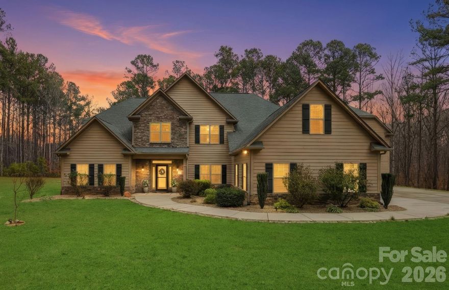 Back on market—offering a valuable second opportunity to own this outstanding property !!Located in the sought-after gated lakeside community of Pebble Bay — complete with a community boat ramp — this exceptional property offers the rare feeling of a private retreat while remaining close to everyday conveniences. Set on 2.1 acres at the end of a long driveway, the home welcomes you with remarkable privacy, peaceful surroundings, and a quiet sense of escape.

The home features 4 bedrooms, 4.5 baths, and versatile bonus spaces on each level — ideal for an office, hobbies, or media area. Total heated living area is approximately 4,576 sq ft and includes a  beautiful 576 sq ft finished room with full bath above the detached garage (permit expired; info available). Five total garage spaces include an oversized attached 3-car garage PLUS a detached 2-car garage, offering flexibility for storage, hobbies, or car enthusiasts.

Soaring two-story ceilings and a dramatic wall of windows with custom motorized shades fill the home with natural light, highlighting a fabulous living area designed for both everyday comfort and entertaining. The chef’s kitchen features double ovens, a gas cooktop, granite countertops, upgraded cabinetry, and a large island with seating for six, flowing seamlessly into the living room with a gas fireplace. A secondary staircase adds everyday convenience.

Outdoor living truly defines the lifestyle here — from evenings in the hot tub beneath the stars to cozy gatherings around the paver fire pit or entertaining by the outdoor fireplace after a day on the lake. The main-level primary suite offers comfort and ease, while three ensuite bedrooms upstairs provide privacy for guests or family. Ample storage includes a spacious floored attic.

Located in Denver, NC with convenient access to Highway 16, shopping, dining, and daily essentials nearby. Easily accessible to Mooresville, Hickory, and Huntersville, with a simple commute via Highway 16 to I-485 and Charlotte Douglas International Airport. The perfect place to call home. Home back on market. Absolutely NO fault of the home or seller. Exceptional home.