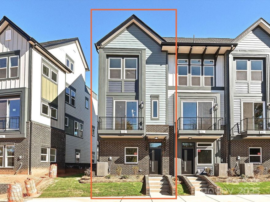 This end-unit townhome has it all - 1-car garage plus driveway parking, 1st floor flex room with powder, seasonal city skyline view from the kitchen terrace, 4th floor rec room with powder, & a spacious rooftop terrace.. Did we mention 9' ceilings throughout, and it's walking distance to Camp North End? Great open layout on the 2nd floor. Kitchen has 42" cabinets w/ matte black hardware, quartz counters, pantry cabinet, LED under-cabinet lights, trash pullout, large SS undermount sink, & GE SS app w/ gas range. 3rd floor hosts the laundry closet and both bedrooms. Premier bath includes quartz counters,  tiled floor, & tiled shower with semi-frameless glass. Guest bath has quartz counters and tiled floor. Matte black hardware in baths. LVP floors throughout 1st & 2nd floors & 3rd floor landing, with oak treads on all stairs.