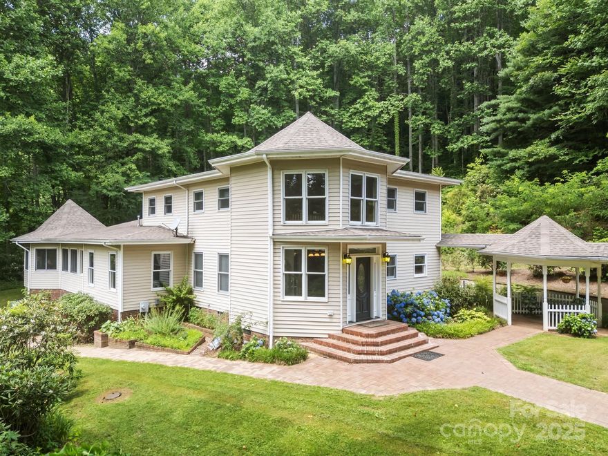 This one-of-a-kind estate nestled on 5.58 acres of serene countryside, offers the perfect blend of comfort, space, and functionality. This beautifully maintained home features 5 spacious bedrooms with walk-in closets, 2 full baths, and 2 half-baths. Primary on main with large on-suite bath. Bonus Room and Four Season room. Eat-in kitchen has large center island, new stainless steel appliances, gas range, and large Butler's Pantry. The inviting interior includes open living areas with natural light, while the expansive outdoor spaces include stocked trout ponds with Gazebo and small barn. Large barn has attached green house. Brick patio with barbecue area. Massive 4-bay auto shop complete with paint booth. Ideal for restoration projects or home business. Whether you're looking for a peaceful retreat, a place to entertain, or the ultimate hobbyist setup, this property has it all. Don't miss your chance to own this versatile and unique estate!