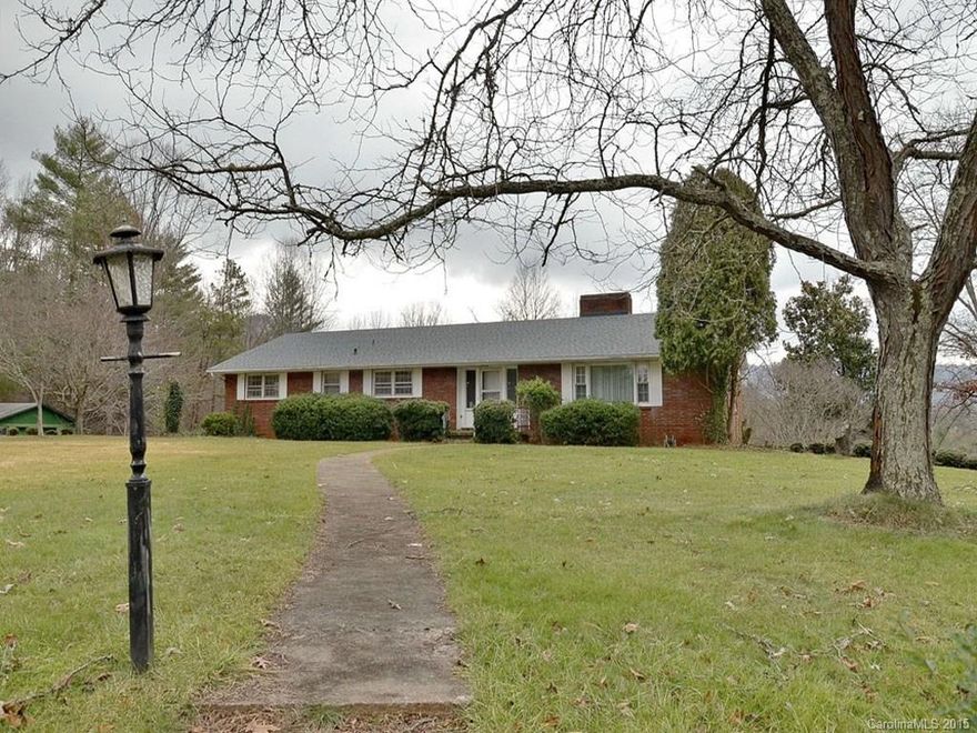 Solid brick rancher on almost 8 private acres, waiting for your buyers personal touch.  New roof in 2014.  2 fireplaces. HUGE, level front yard. Mountain views. Circular drive. Detached storage building.  Additional acreage available