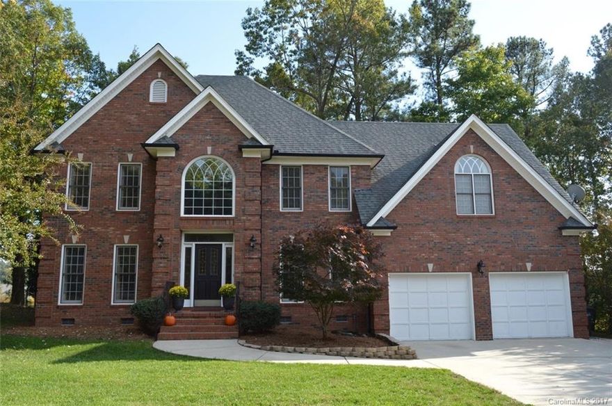 Stately Brick custom home on Golf course in recreational community on Lake Wylie, SC. Renown Ft. Mill Schools. Dramatic 2-story entry w beveled leaded glass.  Formal Living, Dining, Library-Den w custom Bookcases. Custom wood trim. Master Suite w tray ceiling, Bath w Jacuzzi, frameless shower, 2 sinks, vaulted ceiling. Eat-in Kitchen, Island, Corian counters, hardwoods, pantry, Bay window. Bonus Media Room w Surround-sound. 2 Staircases, Central Vac,Security system.Updated:Roof,Bath,Dual HVACs,