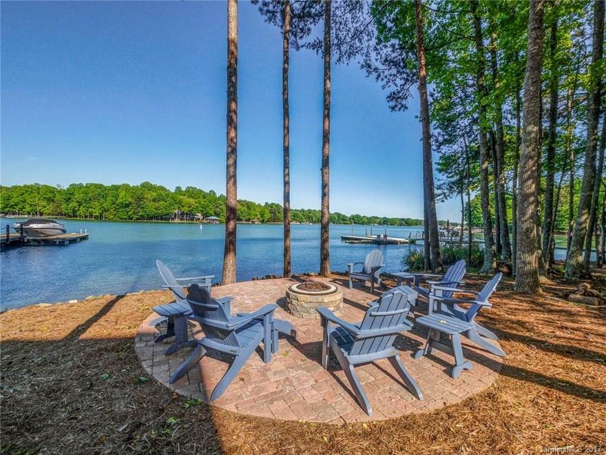 Stunning waterfront brick & cedar shake luxury estate on LKN in The Point boasts great indoor/outdoor flow for entertaining. Step inside foyer to a 2 Story GR, gourmet kitchen w/high end appliances, formal DR, executive office & popular master on main plan all w/upscale finishes & walkout to covered veranda overlooking lake. 3 lg bedrooms & a bonus complete the 2nd floor. LL includes 5th bedroom suite, rec room w/stone fp, bar & media room w/walkout to lake & outdoor kitchen/bar & covered patio.