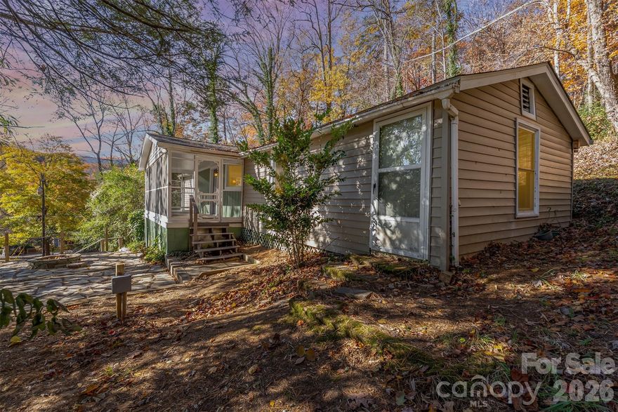 Tucked just minutes from the natural beauty of Chimney Rock State Park and the dining and shopping options of Chimney Rock Village, this charming 2-bedroom, 2-bathroom cottage is the perfect blend of location, comfort, and short-term rental potential.

This cozy mountain retreat features a welcoming, open-concept living space that flows easily between the kitchen, dining, and living areas—ideal for hosting guests after a day spent exploring nearby trails or enjoying Lake Lure. The two bedrooms are thoughtfully positioned and share access to two full bathrooms, making the layout functional and comfortable for visitors.

A standout feature of the home is the screened-in porch, offering a peaceful space to relax with morning coffee or unwind in the evenings while enjoying the surrounding nature. Just beyond, a dedicated fire pit area creates the perfect setting for gathering under the stars—an amenity guests consistently love.

With its proximity to popular restaurants, outdoor attractions, and year-round activities, this low-maintenance cottage is an excellent opportunity for a turnkey Airbnb investment or a personal mountain getaway.