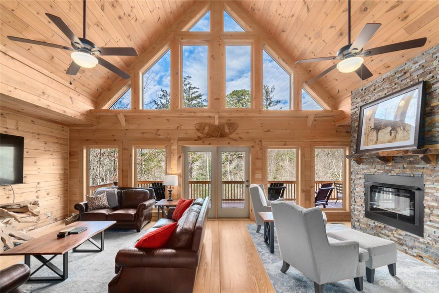 INVESTOR opportunity.  ~ $156K gross rentals 2023. Rentals/reviews to transfer to buyer. 58 - 5 star reviews!
Sits on top of 1.5 acres of beautiful woodlands/streams inside gates of Rumbling Bald Resort. Located only ¼ of a mile from the center of all the amenities and restaurants. This large log cabin is the perfect Lake Lure getaway. It boasts 6 large bedrooms, 4 of them with ensuite bathrooms and an additional 2 guest bathrooms. Two full kitchens, a loft, fireplace and two game rooms. Located just a short drive to hiking, rafting, horseback riding, zip-lining and the famous town of Chimney Rock. Upon entering the double front doors, the grand entry features amazing outdoor views through two stories of windows in this airy and roomy home. The open floor plan of the main level includes a large kitchen, new appliances and dining room with a custom-made dining table and benches, large enough to fit your entire group! Sold completely furnished. TURNKEY https://www.vrbo.com/1872110