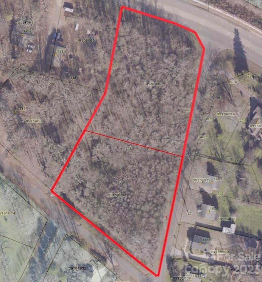 Attention Developers! 
Prime location in Monroe with road frontage on Hwy 601S, Russell Courtney Road, and White Store Road.  Large wooded lot with 2.86 acres.
Currently no utilities. Per City of Monroe: water and sewer are available, tap fees required.  Lots could possibly be subdivided into several more lots if approved.