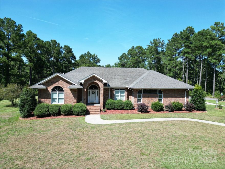 **BEAUTIFUL UPDATED CUSTOM BRICK 3 BEDROOM, 2.5 BATH HOME ON 19.7 ACRES IN THE COUNTRY**

This modern country-style home has been tastefully updated and features a living room with 10-foot tray ceilings and built-in bookshelves. The large kitchen includes a breakfast bar and island with a vented cooktop. The primary bedroom boasts tray ceilings and barn doors leading to a luxurious bathroom with his and hers vanities, private toilet rooms, a clawfoot tub, and a frameless walk-in shower. Bedrooms 2 and 3 share a Jack-and-Jill bath with dual vanities and toilets, plus a walk-in shower. Enjoy a blacked-out shiplap entertainment room, a large patio overlooking the landscaped yard and new pool, and a two-truck carport with an outdoor half-bath. The property also includes a garage/shop area and a horse pasture with mature white oak trees. 

Bring your horses and experience country living at its finest!