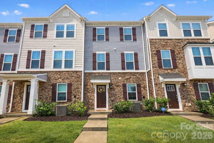 Welcome to this beautifully maintained 3 story townhome in the heart of North Charlotte, where convenience and modern living come together. Located just minutes from I-485, UNCC, Concord Mills, and Uptown Charlotte, you’ll enjoy easy access to shopping, dining, entertainment, and major commuting routes.
The entry level features a spacious 2-car garage with additional storage and a versatile flex space, perfect for a home office, gym, or creative studio. Upstairs, the main living level is filled with natural light and showcases an open-concept layout designed for both everyday living and entertaining. Luxury vinyl plank flooring flows throughout the space. The kitchen is thoughtfully appointed with granite countertops, tile backsplash, 42-inch cabinetry, stainless steel appliances, pantry, and a large center island with bar seating. The dining area opens to a private balcony, offering the perfect spot to relax or unwind. The upper level features a spacious primary suite with a walk-in closet and private bath complete with a dual-sink vanity and tiled shower. Two additional bedrooms, a full bath, and a conveniently located laundry area complete the third floor. Move-in ready and designed for low-maintenance living, this home offers comfort, style, and location all in one. Schedule your showing today.
