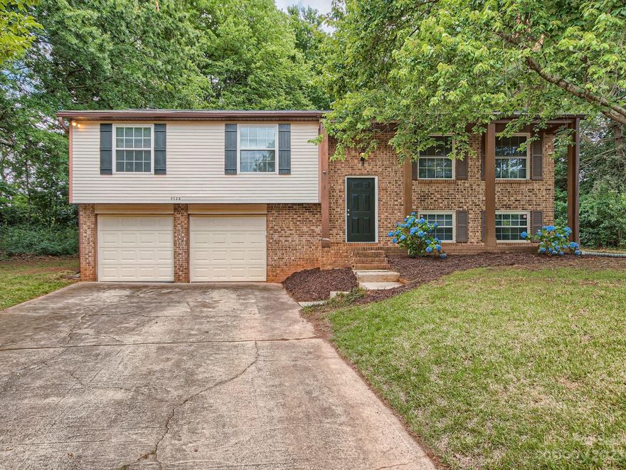 This magnificent 4-bedroom, 2.5-bathroom single-family home is situated at the end of a peaceful cul-de-sac, providing plenty of privacy for you and your family. Boasting a generous lot size of 0.47 acres, this property offers abundant space for outdoor activities and entertainment. The home is a well-maintained 1.5-level house that has undergone recent upgrades, including fresh paint and new floors throughout. The floor plan exudes an open concept feel with plenty of natural light.  2-car garage, provides ample space for your vehicles and storage. The home is located conveniently close Uptown, the light rail, and UNCC which offers many attractions including entertainment, dining, and shopping. Don't miss this incredible opportunity to call this delightful property your home. Schedule a showing today and experience the perfect balance of privacy, convenience, and comfort that this College Down property has to offer.