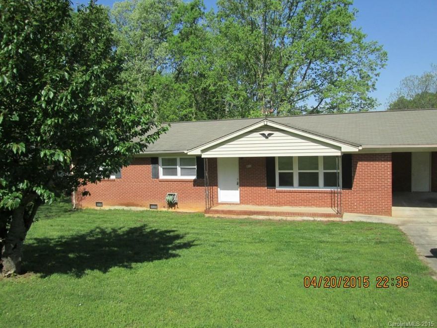 This adorable home is ready to move in!! Totally renovated with new paint, new laminate flooring, new kitchen counters, the bath and half have been completely remodeled, the original hardwoods in living and bedrooms have been refinished.....Looks much better than can be described! Must see inside.......