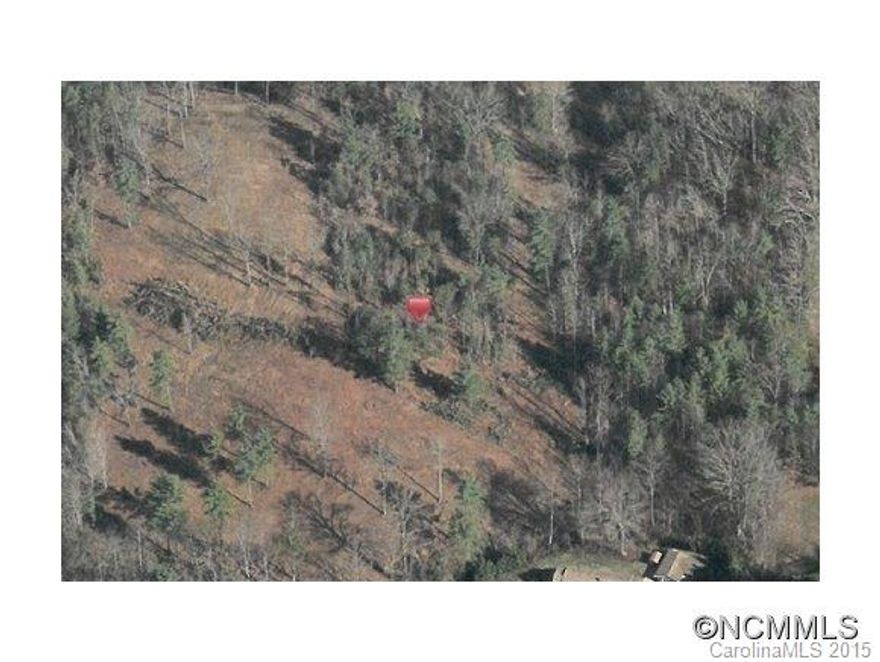 Downtown Weaverville. 7.65 acres zoned C-2. Walk to shopping and restaurants. Ready for development. Rolling topo with creek.