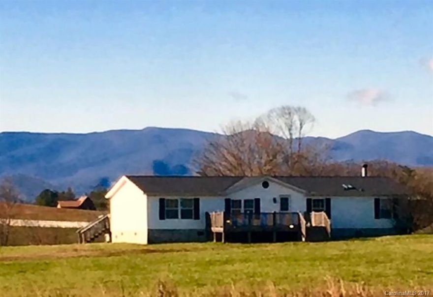 This property has it all !! Year round Mountain Views, Pasture land, river frontage, and unrestricted. It also has a nicely updated home that can be rented or used prior to building your dream house. Dont miss out on this unique property.   Includes pin 9516-48-2111-000.