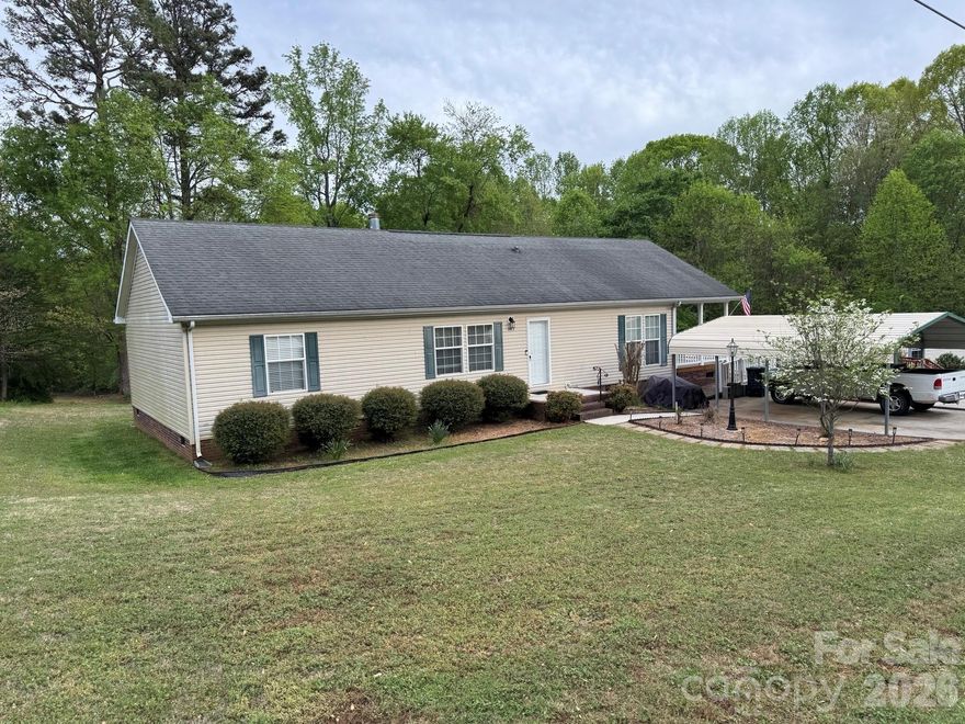 Welcome home to peaceful country living just minutes from town! This well-maintained 1,404 sq ft manufactured home sits on a spacious 0.4-acre lot in desirable Statesville, NC, offering the perfect blend of privacy and convenience.

Step inside to find a bright and inviting floor plan with generous living spaces, ideal for both relaxing and entertaining. The home features a comfortable living area, a well-appointed kitchen with ample cabinet space, and a dining area perfect for family meals. The split-bedroom layout provides added privacy, with a spacious primary suite that includes a private bath and plenty of closet space.

Outside, enjoy the open yard with room for gardening, pets, or outdoor gatherings. With nearly half an acre, there’s space to create your own backyard retreat — whether that’s a fire pit, play area, or workshop.

Located in North Carolina’s scenic Iredell County, this property offers a quiet setting while still being conveniently close to shopping, dining, schools, and major highways.

Whether you're a first-time buyer, downsizing, or looking for an investment opportunity, this property is full of potential. Don’t miss your chance to make it yours — schedule your showing today!