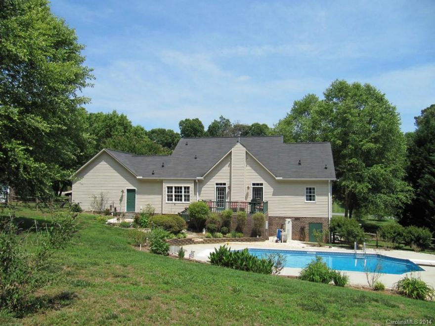 Cool off in the 16x32 in-ground pool with 2012 liner. Relax in what feels like a mountain retreat with rocking chair front porch and brick back porch overlooking pool in fenced yard. Front door opens to formal DR to right and LR or office to left. Walk forward to 2-story GR with gar logs. Wide-plank pine flrs in D/R and kitchen. HW in den and MBR. Smooth top range in center island. Fridge remains. MBR on main has jetted tub and sep.shwr. Bonus rm has closet where pull out couch bed can remain.