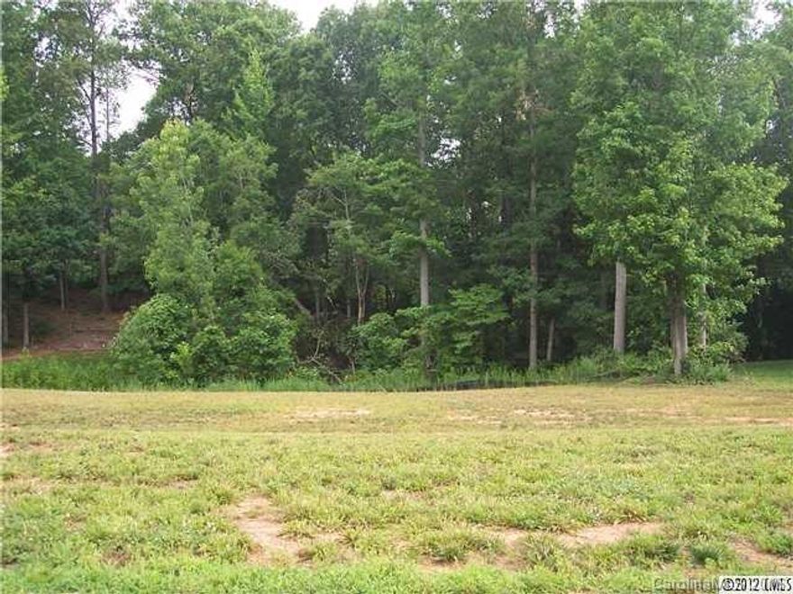 Gorgeous lot to build your dream home in highly desired Waterford Green, right across from Gaston Day School. One of the last remaining lots. Priced under tax value. Great topography for walk-out basement. Woods in back.