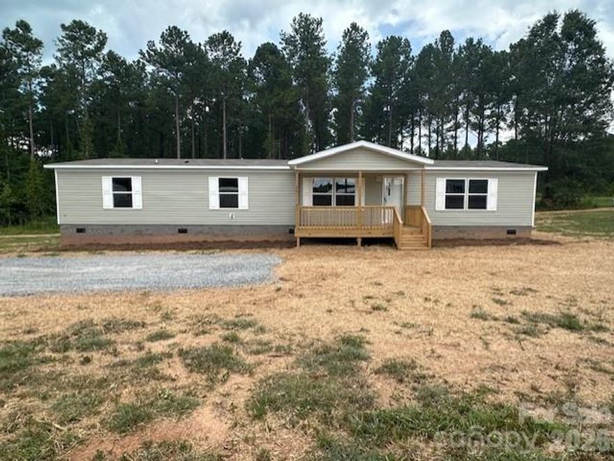 Check out this BRAND NEW 4 bedroom, 2 bath double-wide on over 1.6 acres.  Looking for space, you have it here.  As you walk up to the new covered deck, you enter the front door into the living room area.  Your primary master bedroom and bathroom are located on one side of the house, where your additional three bedrooms are located on the other end.   You walk into the open concept where you see the kitchen, dining, and family room. The kitchen includes all new appliances, refrigerator, dishwasher, and oven.  With over 1.5 acres included, you have plenty of outdoor space for entertaining, gardening, etc.  House comes with a Warranty! This will not last long!