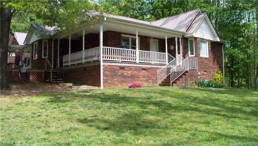 Very secluded Brick Ranch w/ wrap around porch on 8 + wooded acres with lots of updates within last 5 years--1 Bedroom 1 Bath apartment with Living Rm and Kitchen over Detached garage/shop--Metal carports stay with property but some outbldgs may not stay--Land is perfect shape with rd frontage on 2 roads