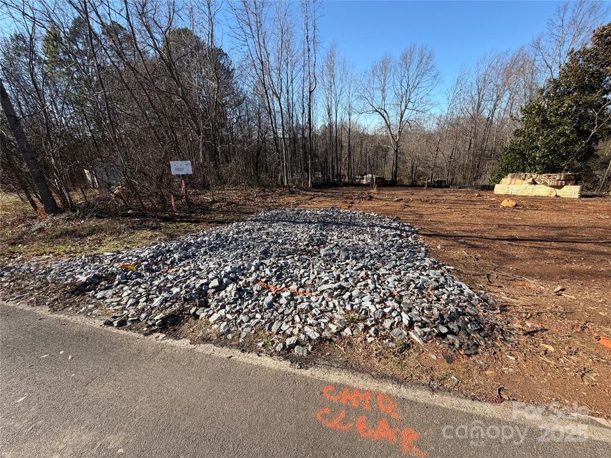 BUILD-READY DOUBLE LOT IN KINGS MOUNTAIN! Rare opportunity to secure a fully prepared, shovel-ready homesite totaling approximately 1.13 acres across two parcels (Gaston County Parcels 155663 & 155671). This property has been meticulously developed to save you months of sitework and permitting. The lot is already surveyed, cleared, and graded with erosion control in place, a temporary driveway installed, and the build site professionally staked and ready for footers. City water is available with the tap already installed through Kings Mountain, and a 3-bedroom septic permit will be provided to the buyer. This offering also includes a 3 Bed/2 Bath house plan that has previously appraised for $320k. Whether you are an investor or looking to build your custom dream home immediately, this lot is truly ready for your dream to begin.
